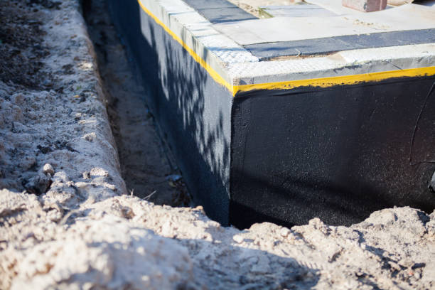 Professional Waterproofing technician working in Petersburg, IN